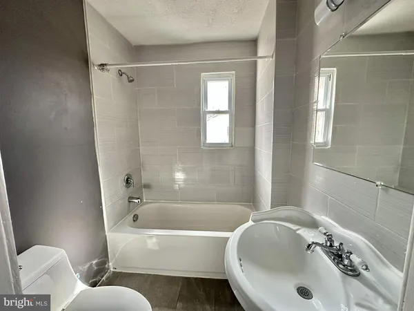 a bathroom with a sink and a bathtub