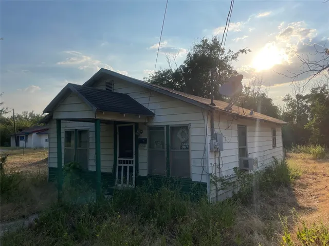 a house view with a garden space