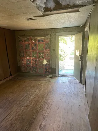 a kitchen with a sink window and cabinets