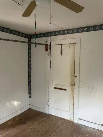a bathroom with a granite countertop toilet and a sink