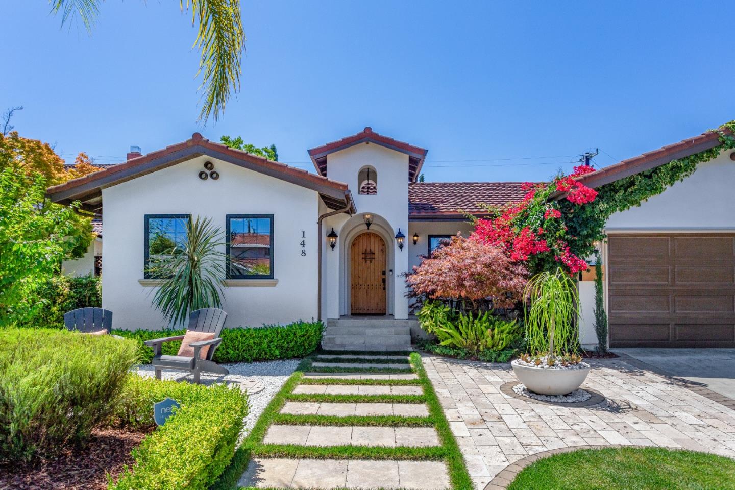 148 Connemara Way Sunnyvale, CA 94087 - Photo 1 of 1 a front view of a house with a garden