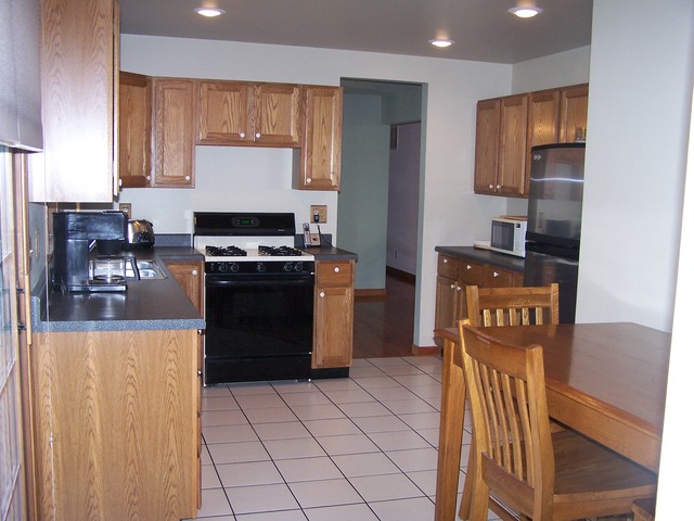 3568 East 28th Road Seneca, IL 61360 - Photo 3 of 19 a kitchen with granite countertop a refrigerator stove and sink