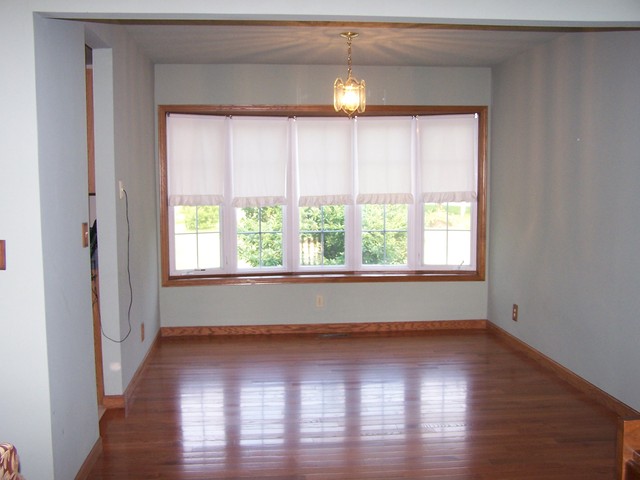 3568 East 28th Road Seneca, IL 61360 - Photo 5 of 19 a view of an empty room with wooden floor and a window