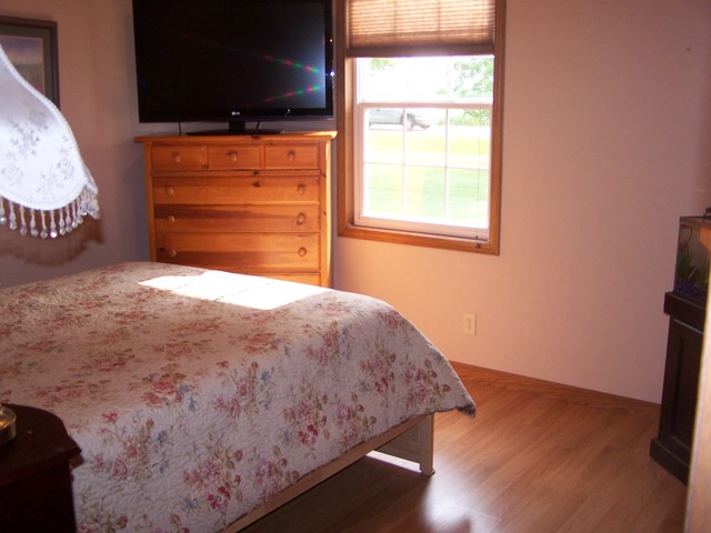 3568 East 28th Road Seneca, IL 61360 - Photo 9 of 19 a bedroom with a bed and a flat tv screen