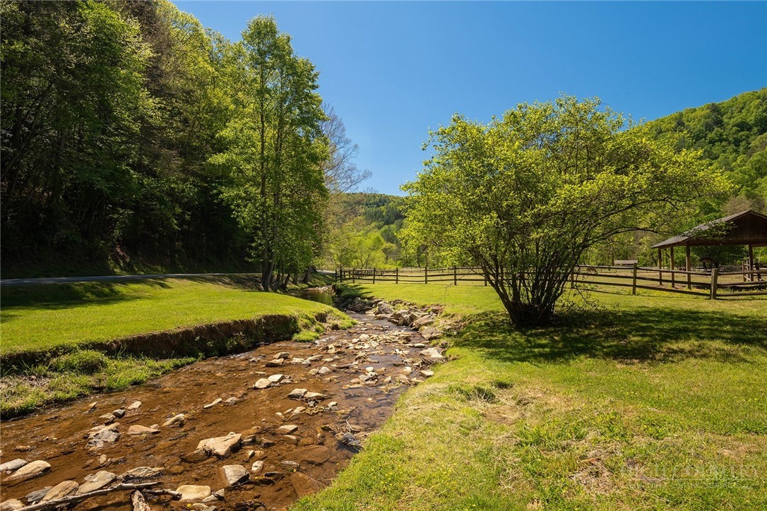 22 Elk Ridge Road Ferguson, NC 28624 - Photo 15 of 16 a view of a swimming pool with a yard