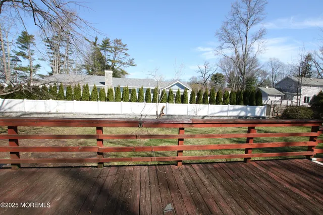 a view of park with wooden fence