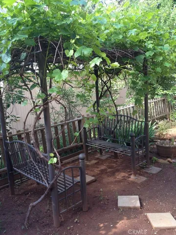 a view of backyard with deck and outdoor seating