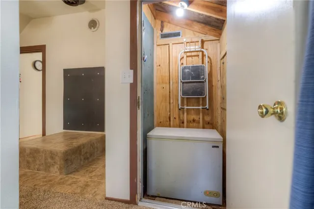 a view of a livingroom with a ceiling fan and window