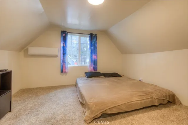 a kitchen with a refrigerator sink and cabinets