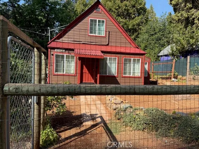a front view of a house with garage