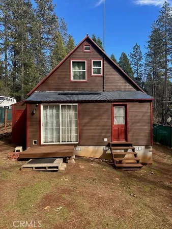 a house with trees in front of it