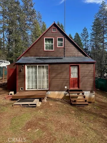 a house with trees in front of it