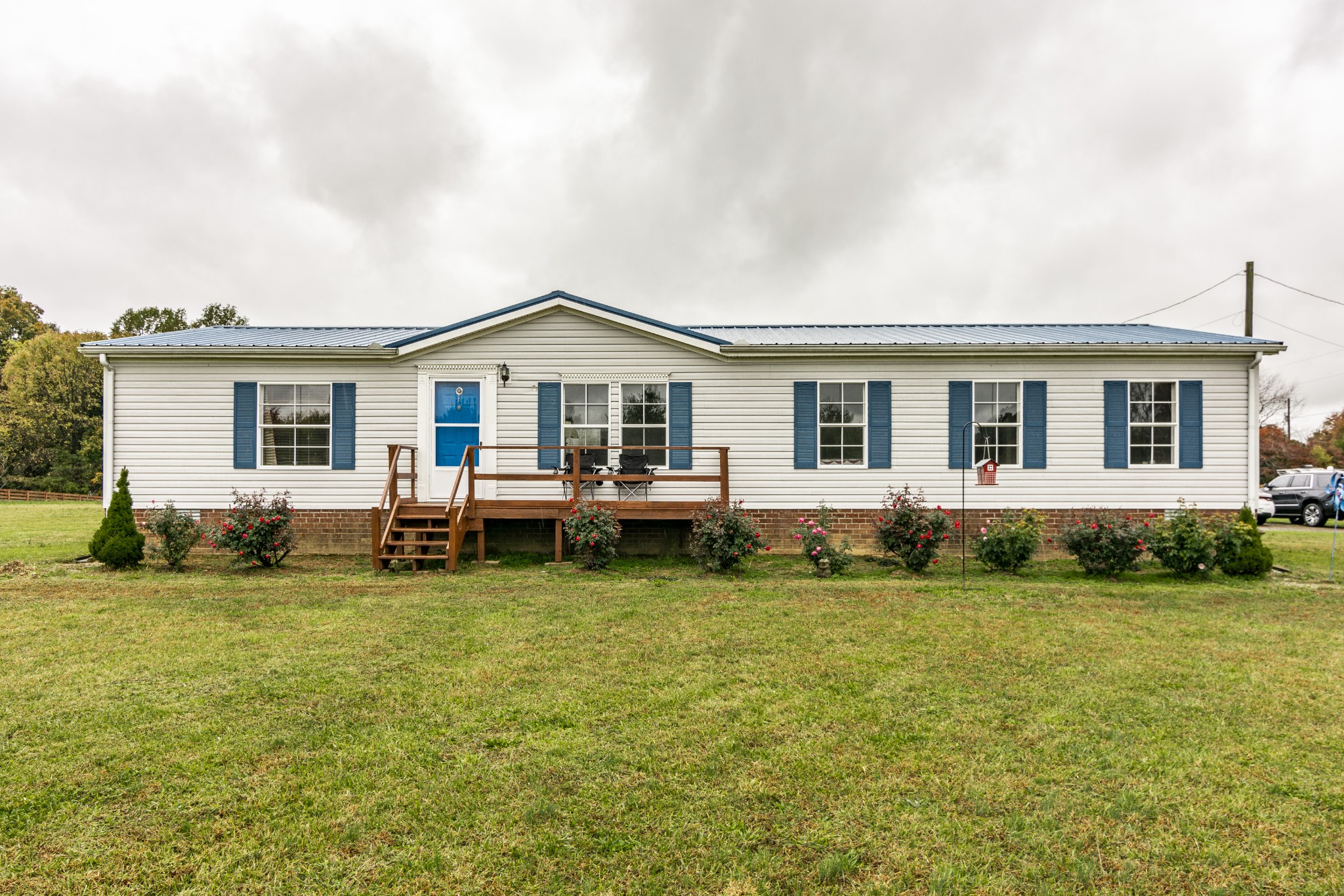 128 East Biggs Road Portland, TN 37148 - Photo 1 of 43 a view of a house with a yard and sitting space