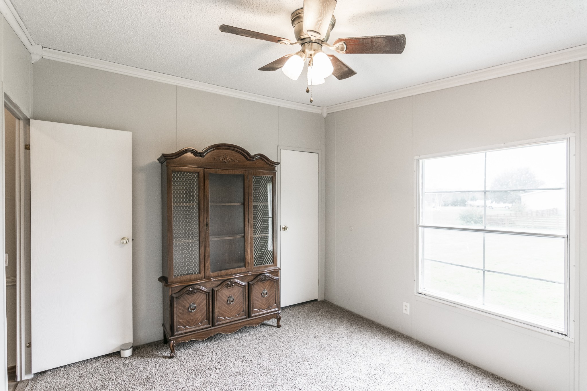 128 East Biggs Road Portland, TN 37148 - Photo 13 of 43 a view of a livingroom with a ceiling fan and window