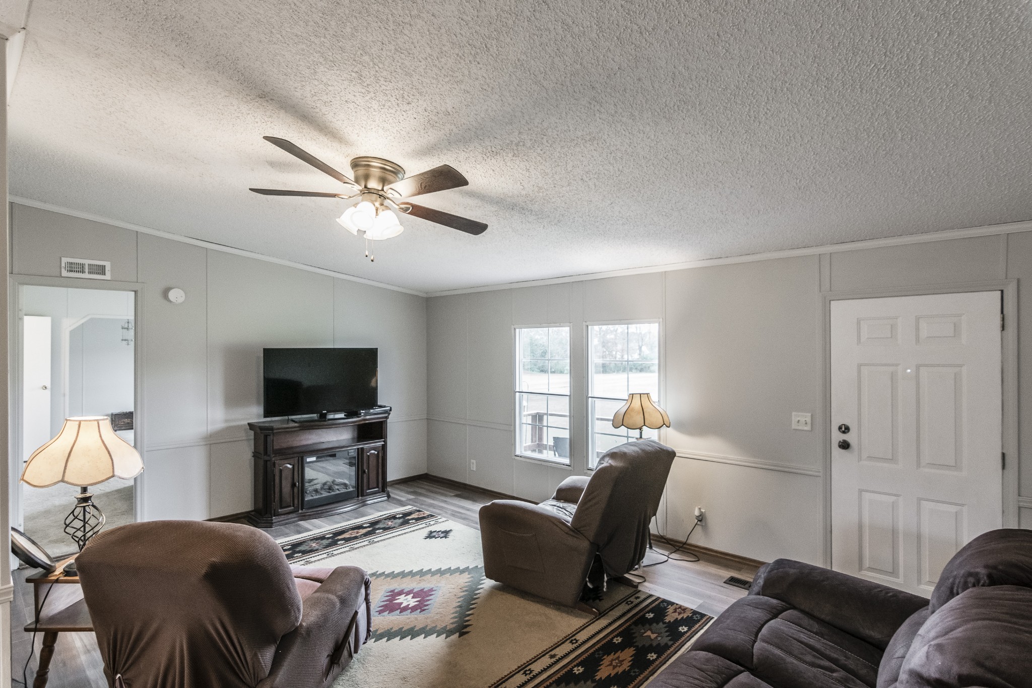 128 East Biggs Road Portland, TN 37148 - Photo 16 of 43 a living room with furniture and a flat screen tv