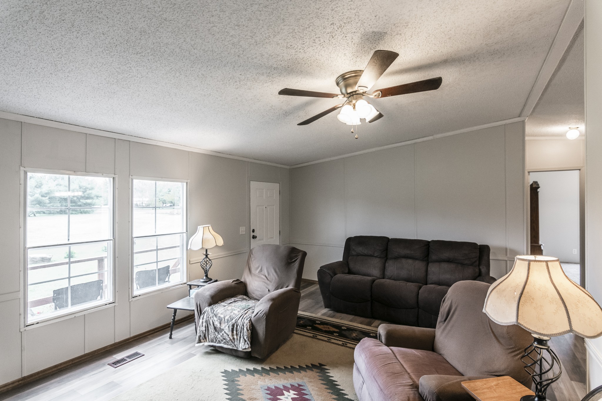 128 East Biggs Road Portland, TN 37148 - Photo 19 of 43 a living room with furniture a ceiling fan and a window