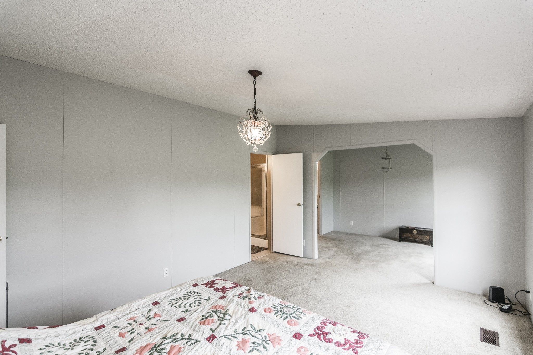 128 East Biggs Road Portland, TN 37148 - Photo 21 of 43 a bedroom with a bed and a chandelier