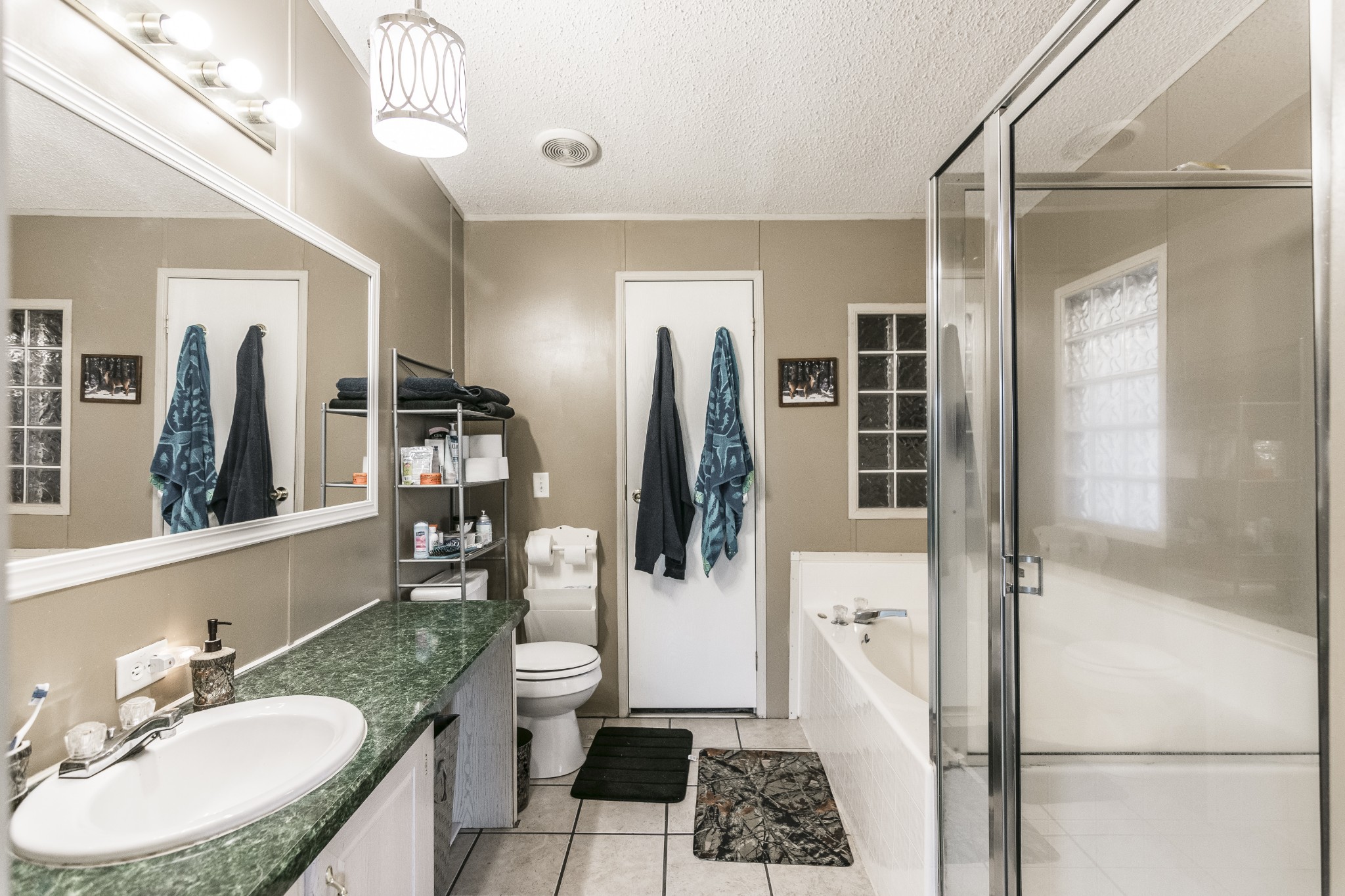 128 East Biggs Road Portland, TN 37148 - Photo 26 of 43 a bathroom with a sink double vanity and shower