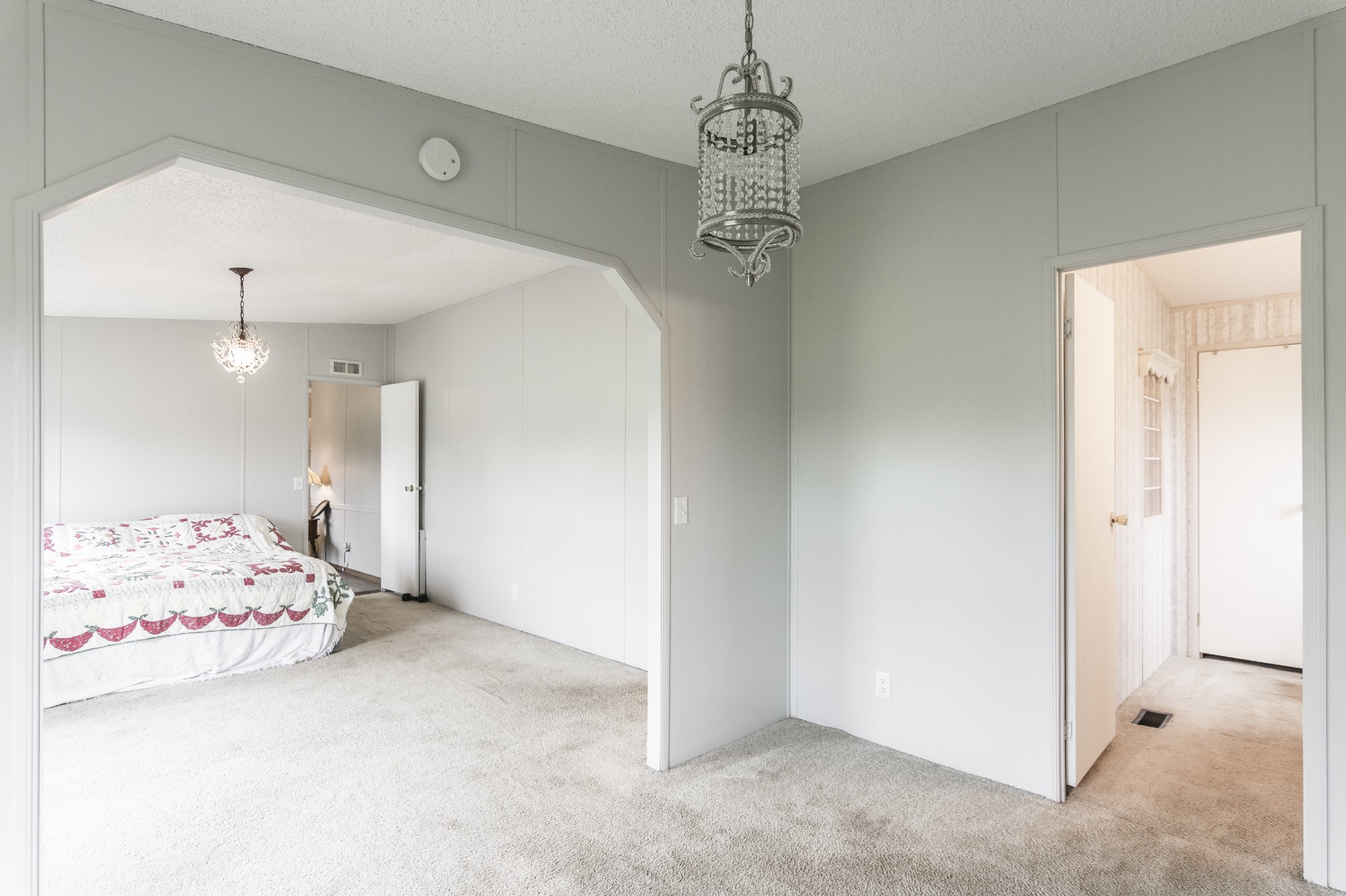 128 East Biggs Road Portland, TN 37148 - Photo 28 of 43 a bedroom with a bed and a chandelier fan