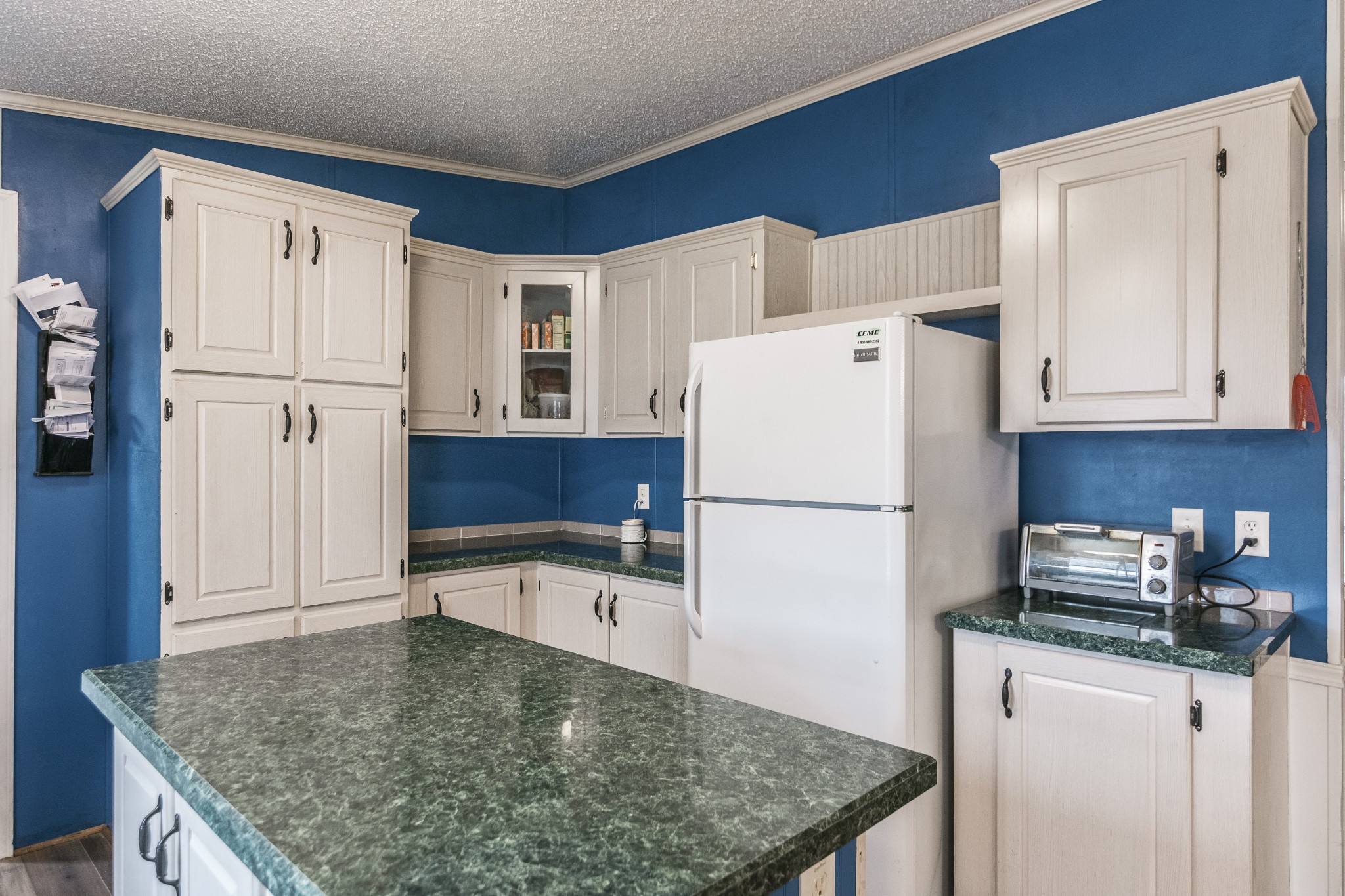 128 East Biggs Road Portland, TN 37148 - Photo 5 of 43 a kitchen with refrigerator and cabinets