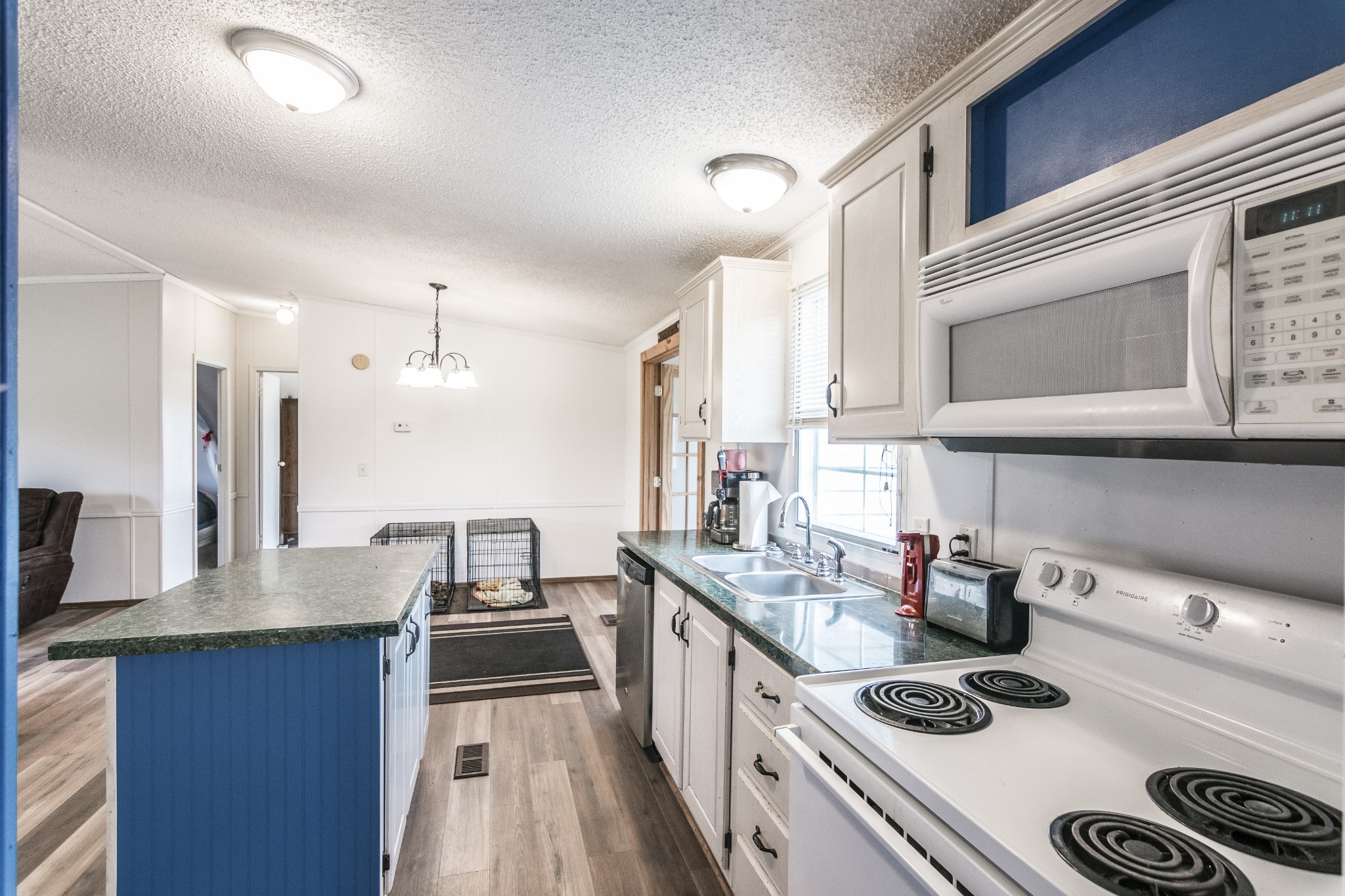128 East Biggs Road Portland, TN 37148 - Photo 8 of 43 a kitchen with kitchen island granite countertop a stove and a sink