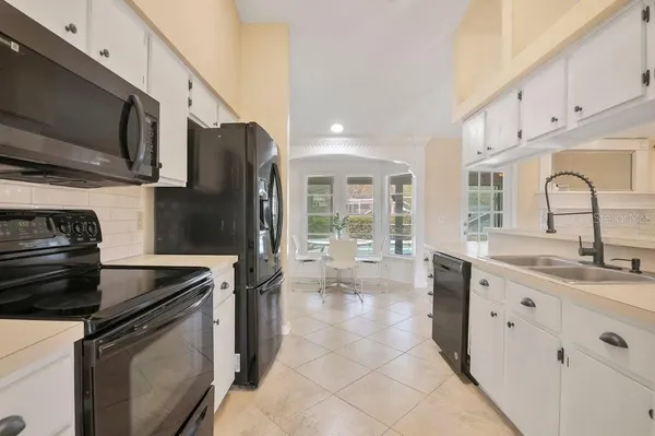a view of an empty room and wooden floor