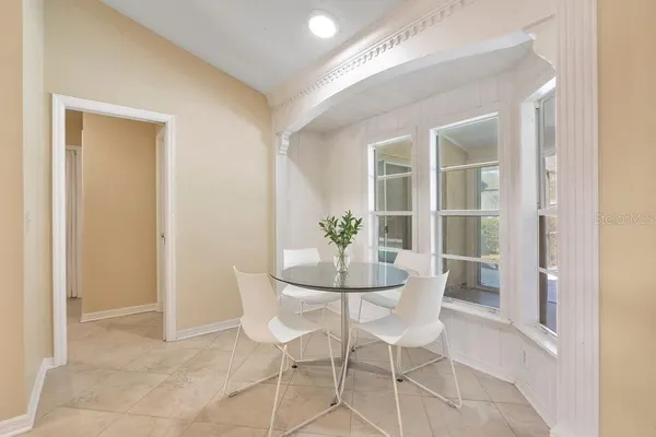 a large white tub sitting next to a white sink