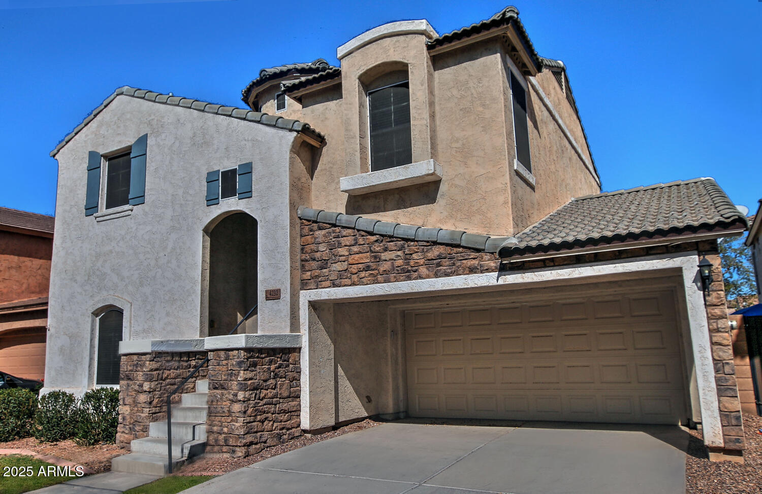 4232 East Tyson Street Gilbert, AZ 85295 - Photo 1 of 38 a front view of a house with garage