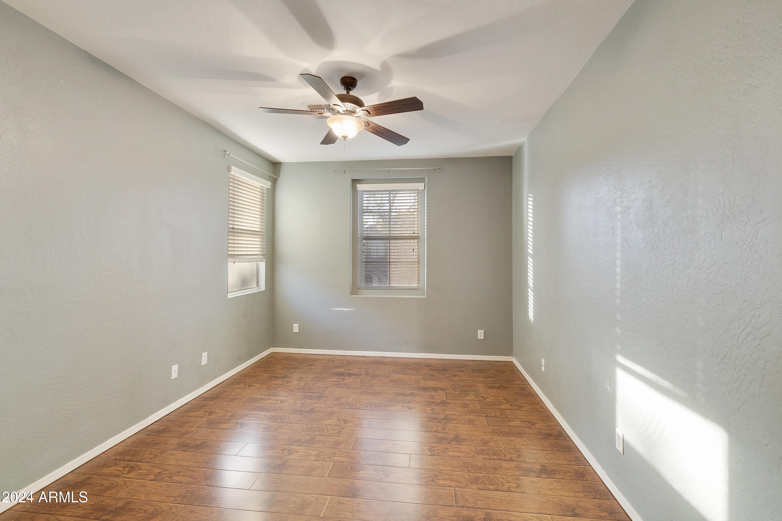 4232 East Tyson Street Gilbert, AZ 85295 - Photo 11 of 38 a view of empty room with wooden floor and fan