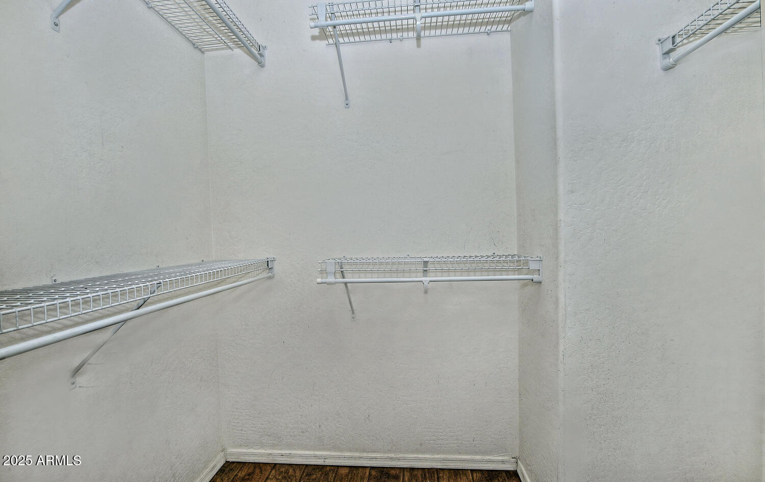 4232 East Tyson Street Gilbert, AZ 85295 - Photo 14 of 38 a view of a room with racks on the wall