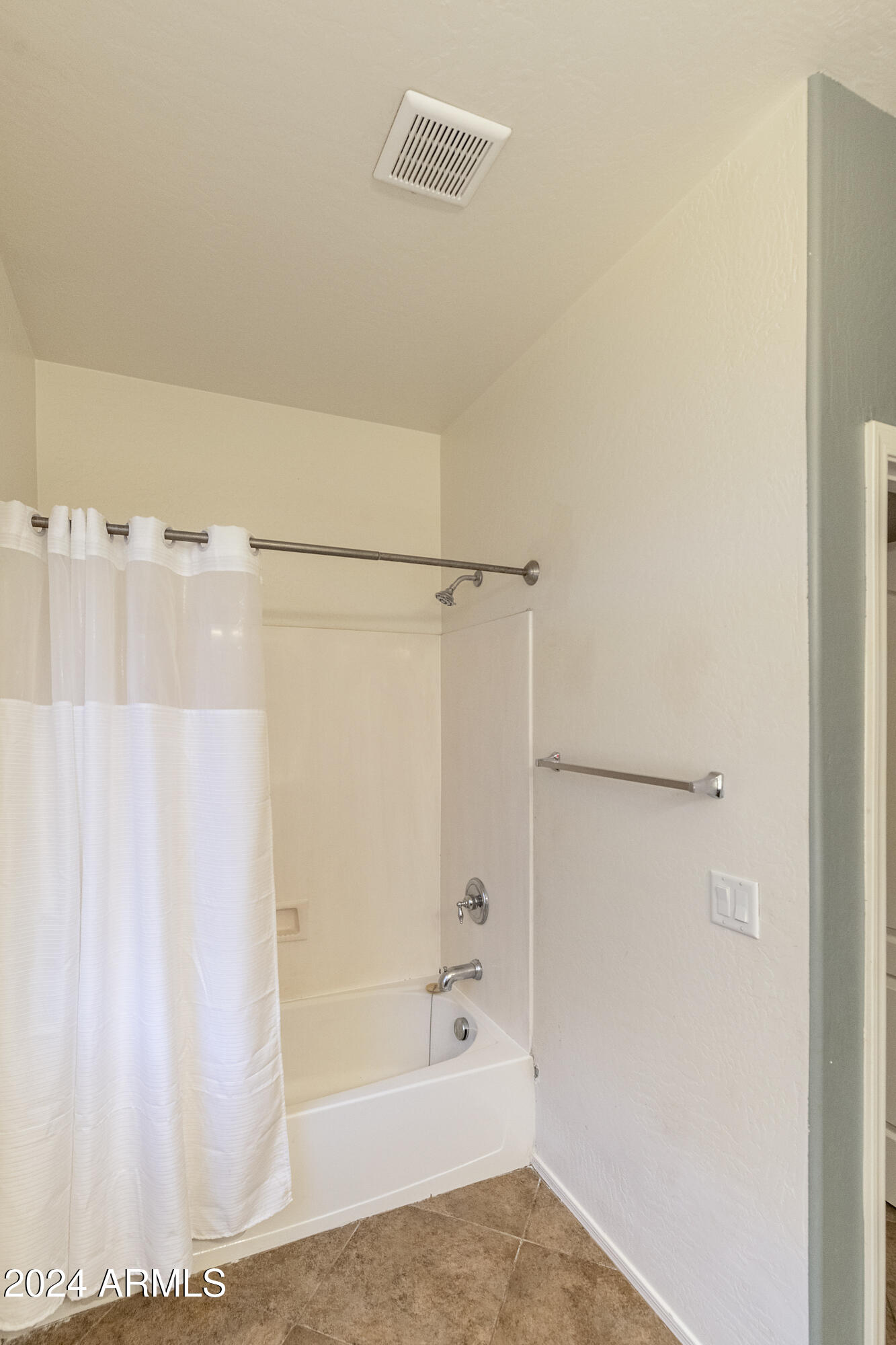 4232 East Tyson Street Gilbert, AZ 85295 - Photo 17 of 38 a bathroom with a bathtub and a shower