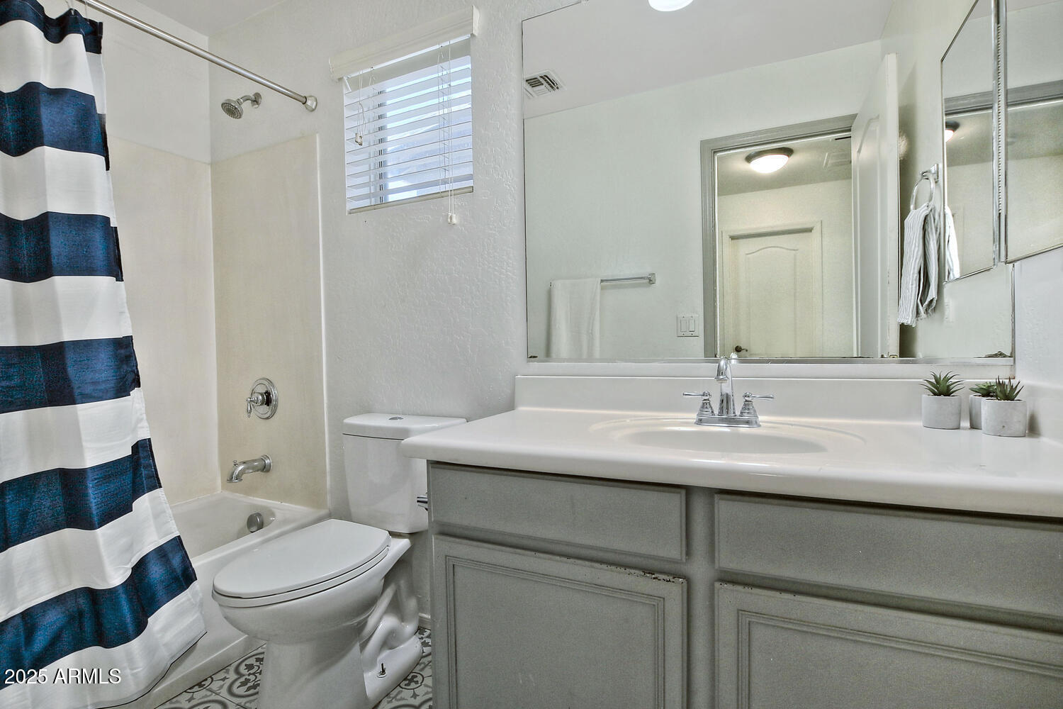 4232 East Tyson Street Gilbert, AZ 85295 - Photo 21 of 38 a bathroom with a sink toilet and shower