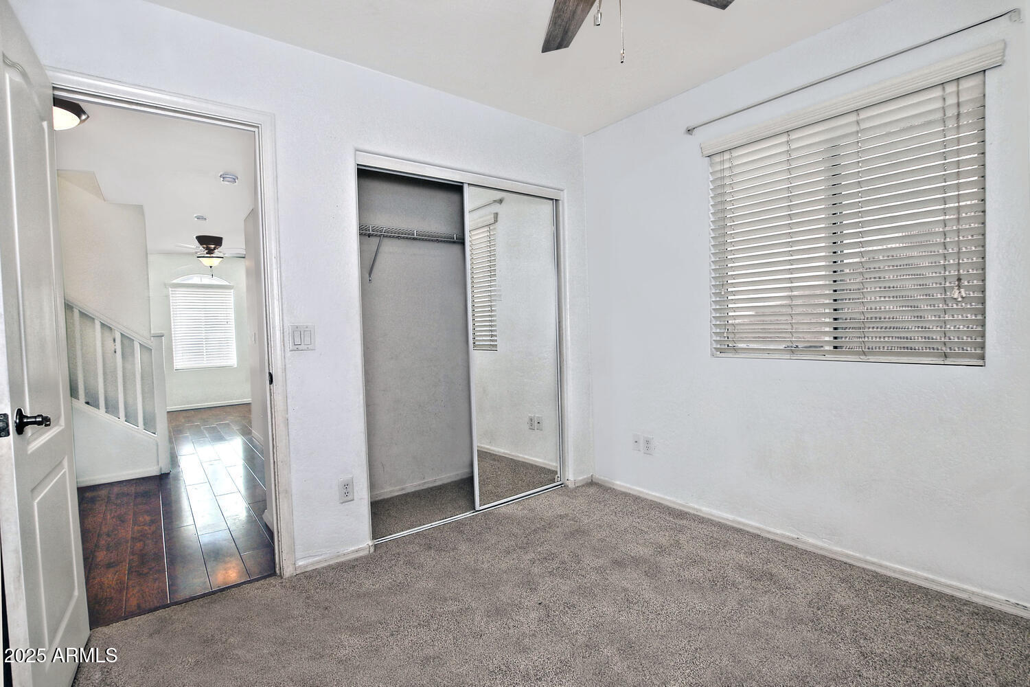 4232 East Tyson Street Gilbert, AZ 85295 - Photo 22 of 38 an empty room with windows and closet