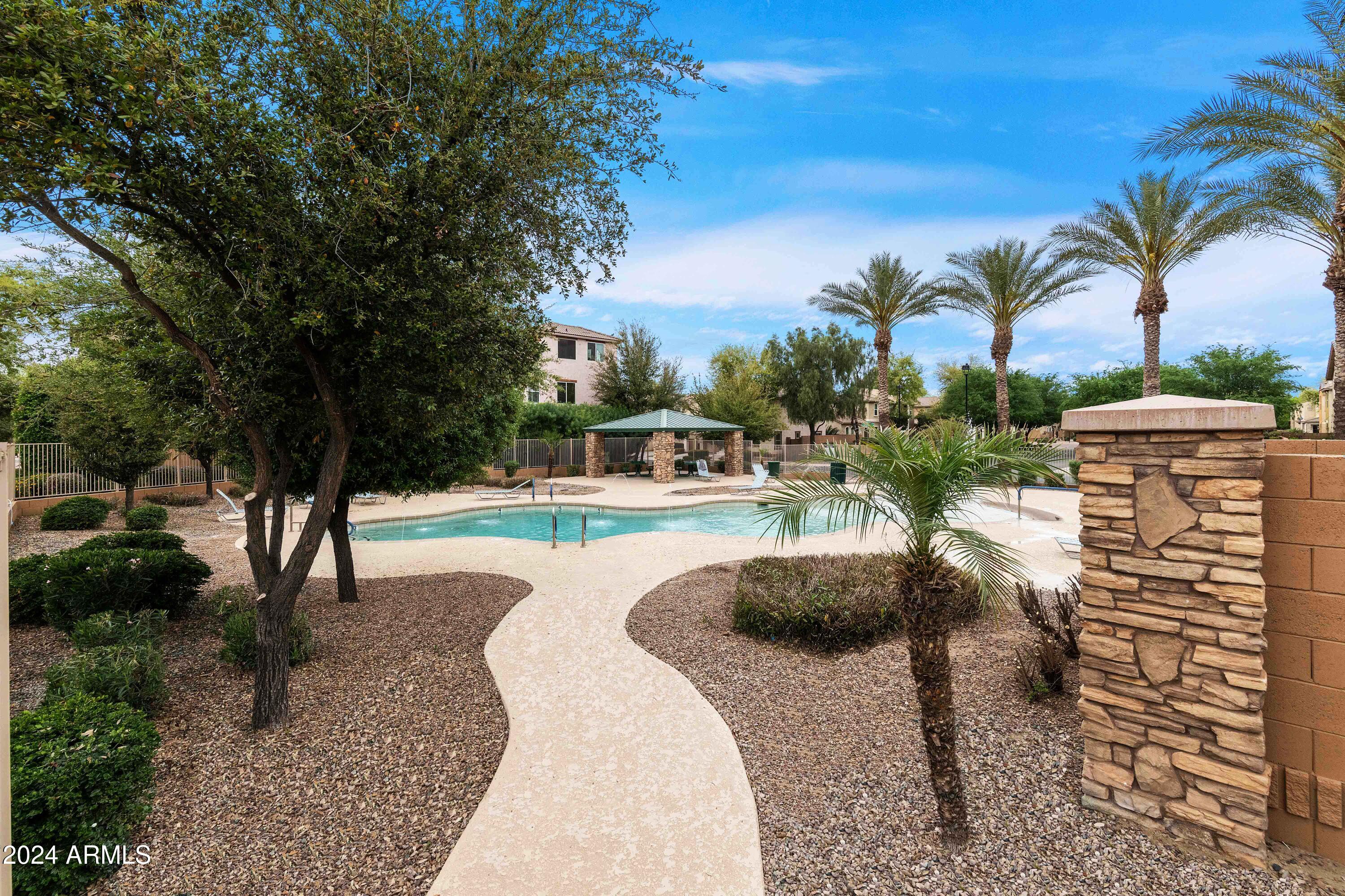 4232 East Tyson Street Gilbert, AZ 85295 - Photo 34 of 38 a swimming pool with outdoor seating and yard