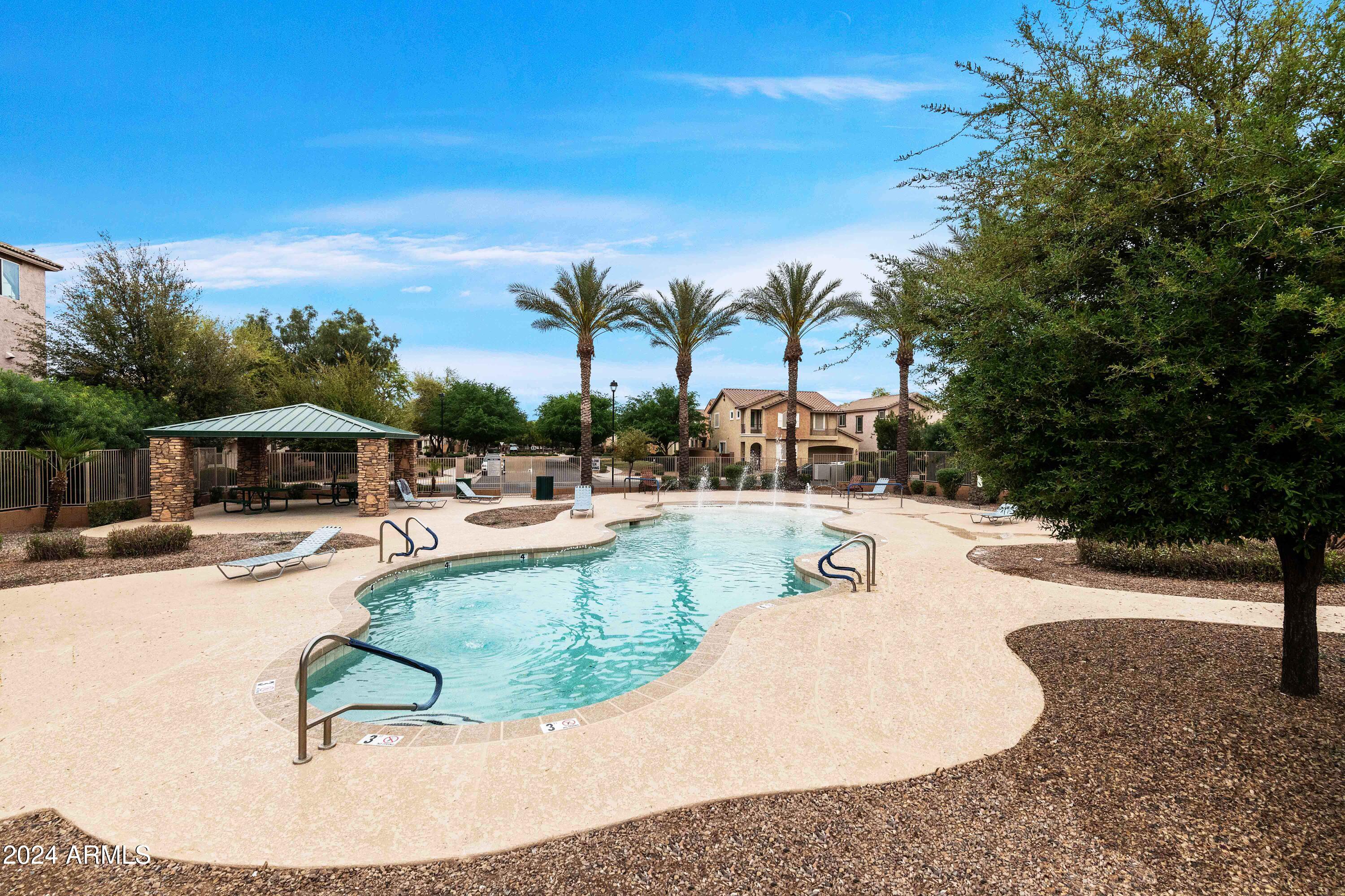 4232 East Tyson Street Gilbert, AZ 85295 - Photo 35 of 38 a swimming pool with outdoor seating and yard