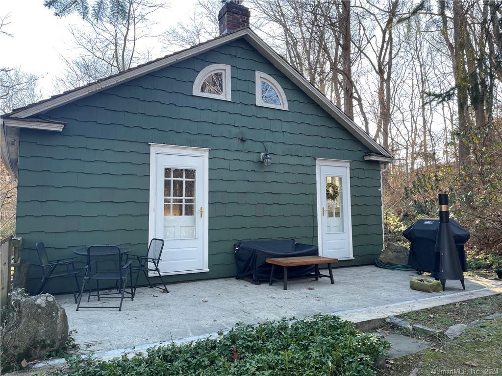 87 B Red Coat Road Westport, CT 06880 - Photo 17 of 17 a view of a house with a patio