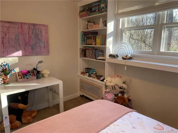 a bed room with a bed and a window