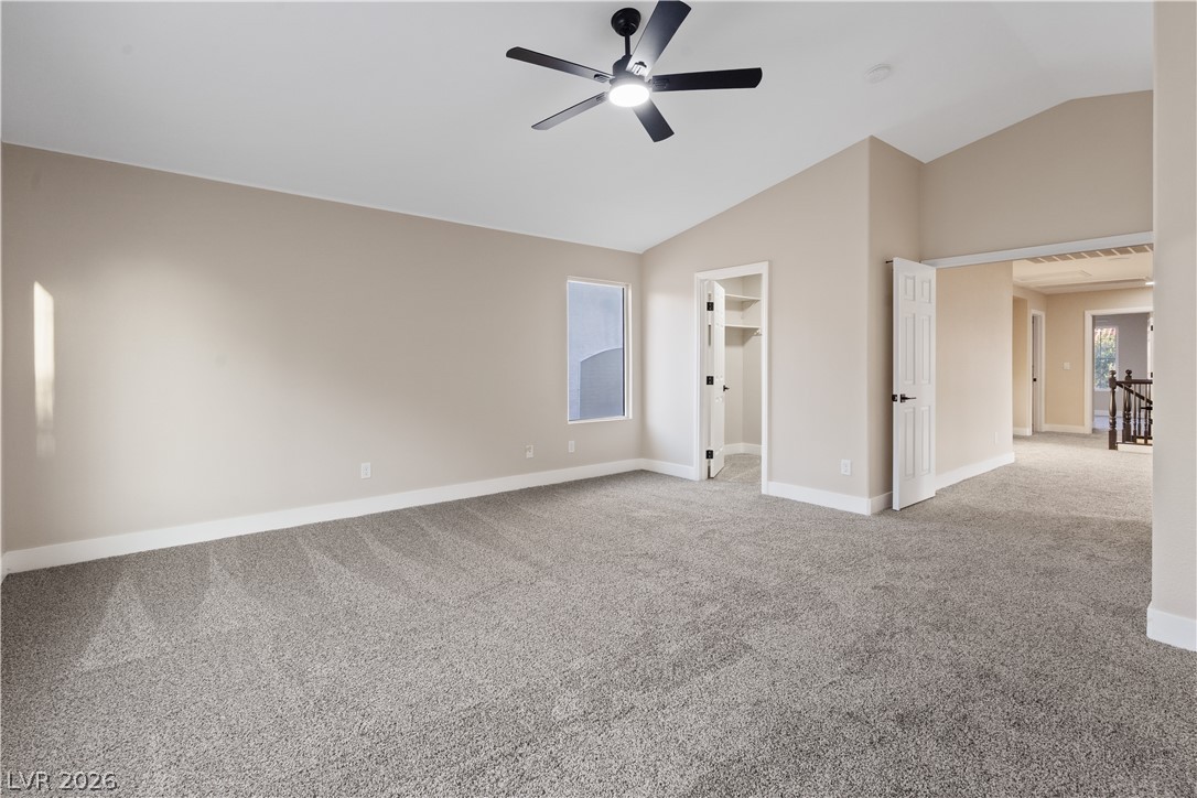 1662 Ravanusa Drive Henderson, NV 89052 - Photo 19 of 74 Lofty ceilings and soft carpeting create a serene and airy primary bedroom retreat.