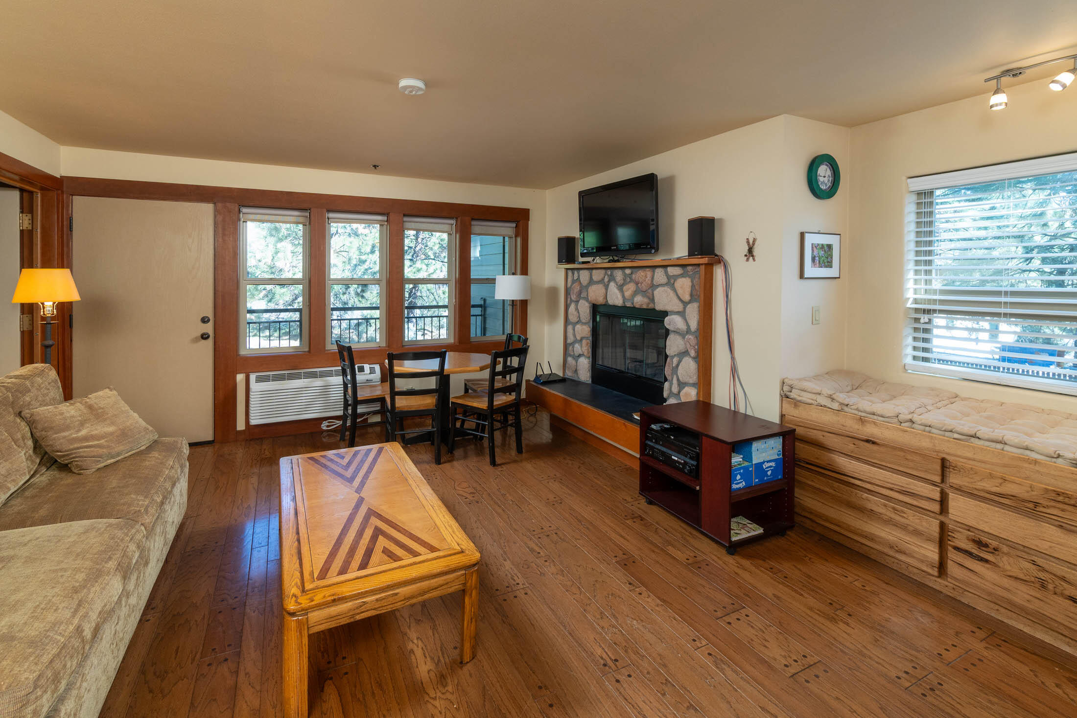 18575 Southwest Century Drive, Unit 2018 Bend, OR 97702 - Photo 1 of 32 a living room with furniture windows and a fireplace