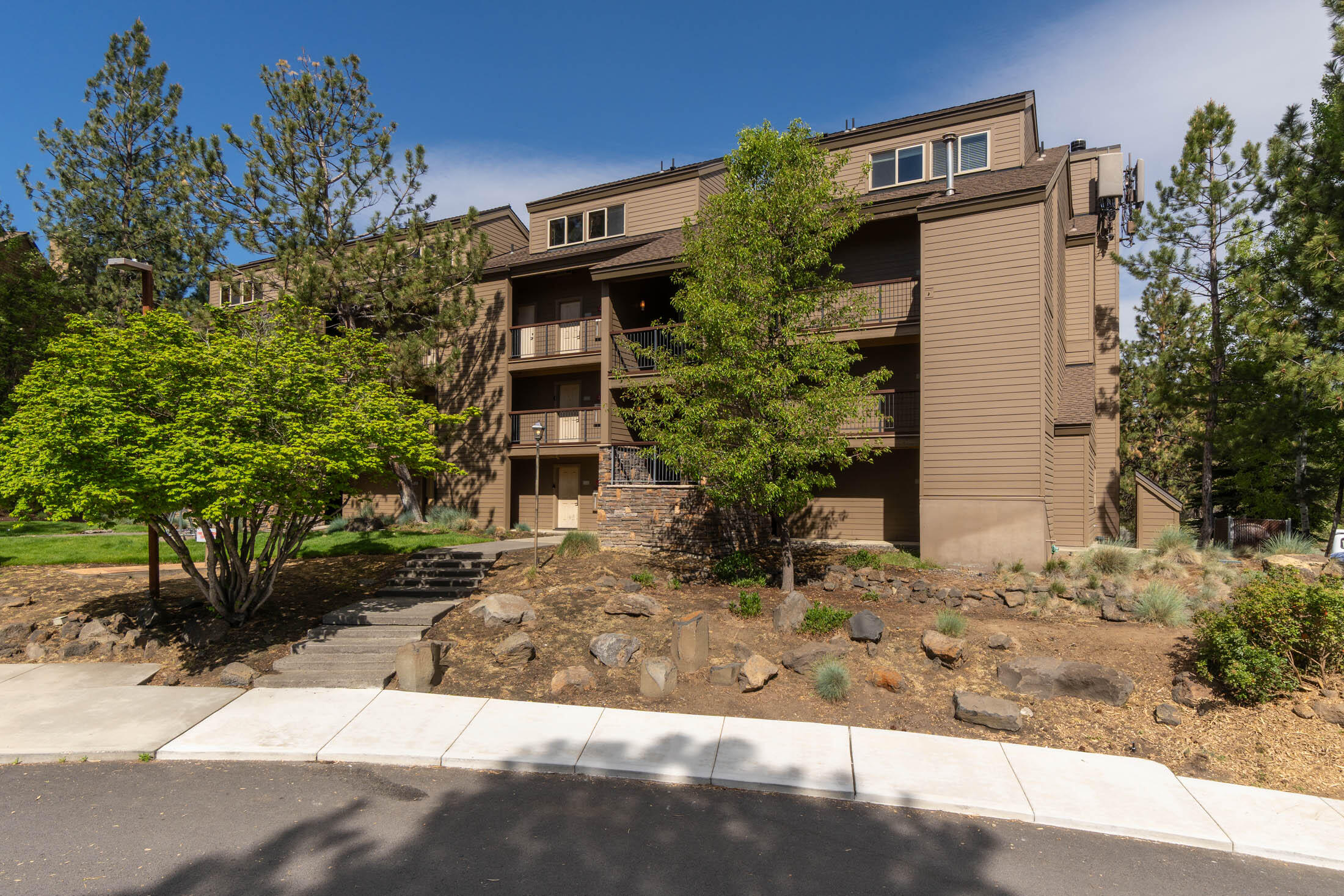18575 Southwest Century Drive, Unit 2018 Bend, OR 97702 - Photo 22 of 32 a view of a house with potted plants