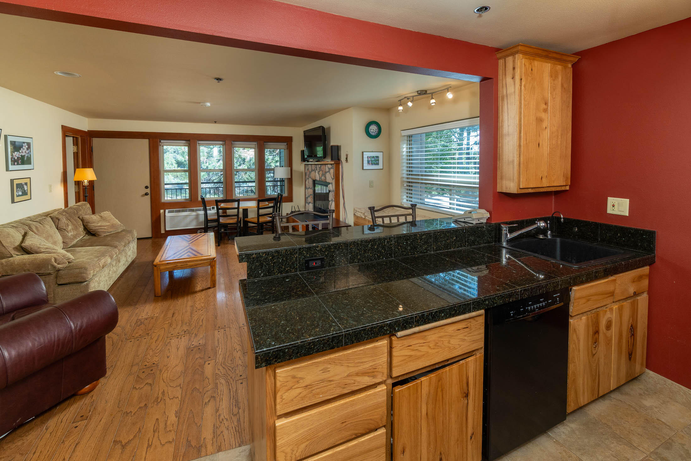 18575 Southwest Century Drive, Unit 2018 Bend, OR 97702 - Photo 5 of 32 a kitchen with granite countertop a sink and a stove