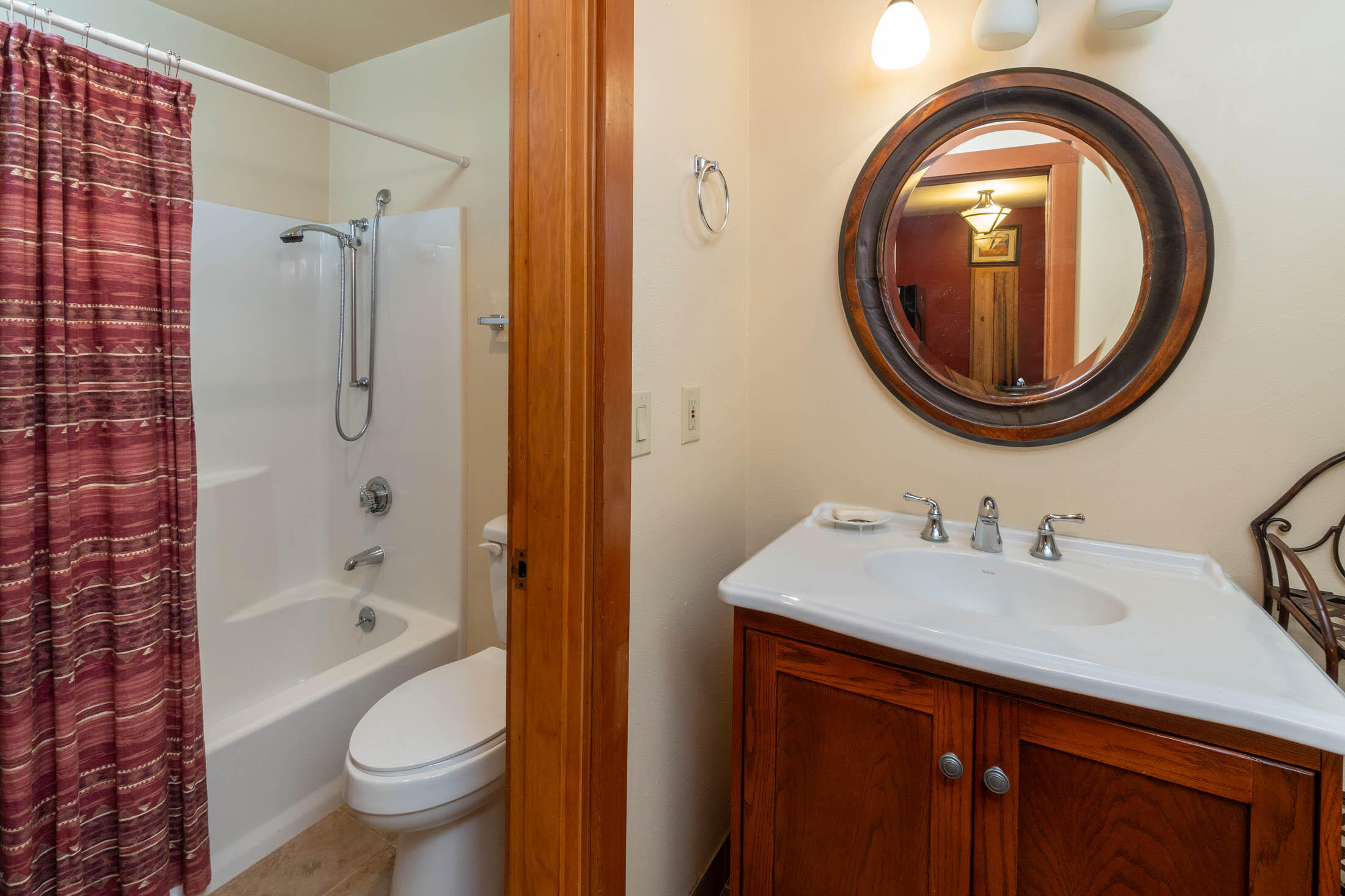 18575 Southwest Century Drive, Unit 2018 Bend, OR 97702 - Photo 6 of 32 a bathroom with a sink a toilet and a mirror