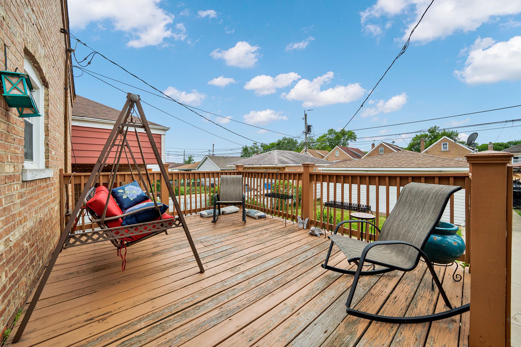7234 South Ridgeway Avenue Chicago, IL 60629 - Photo 23 of 27 a roof deck with table and chairs