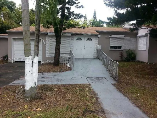 a front view of a house with parking