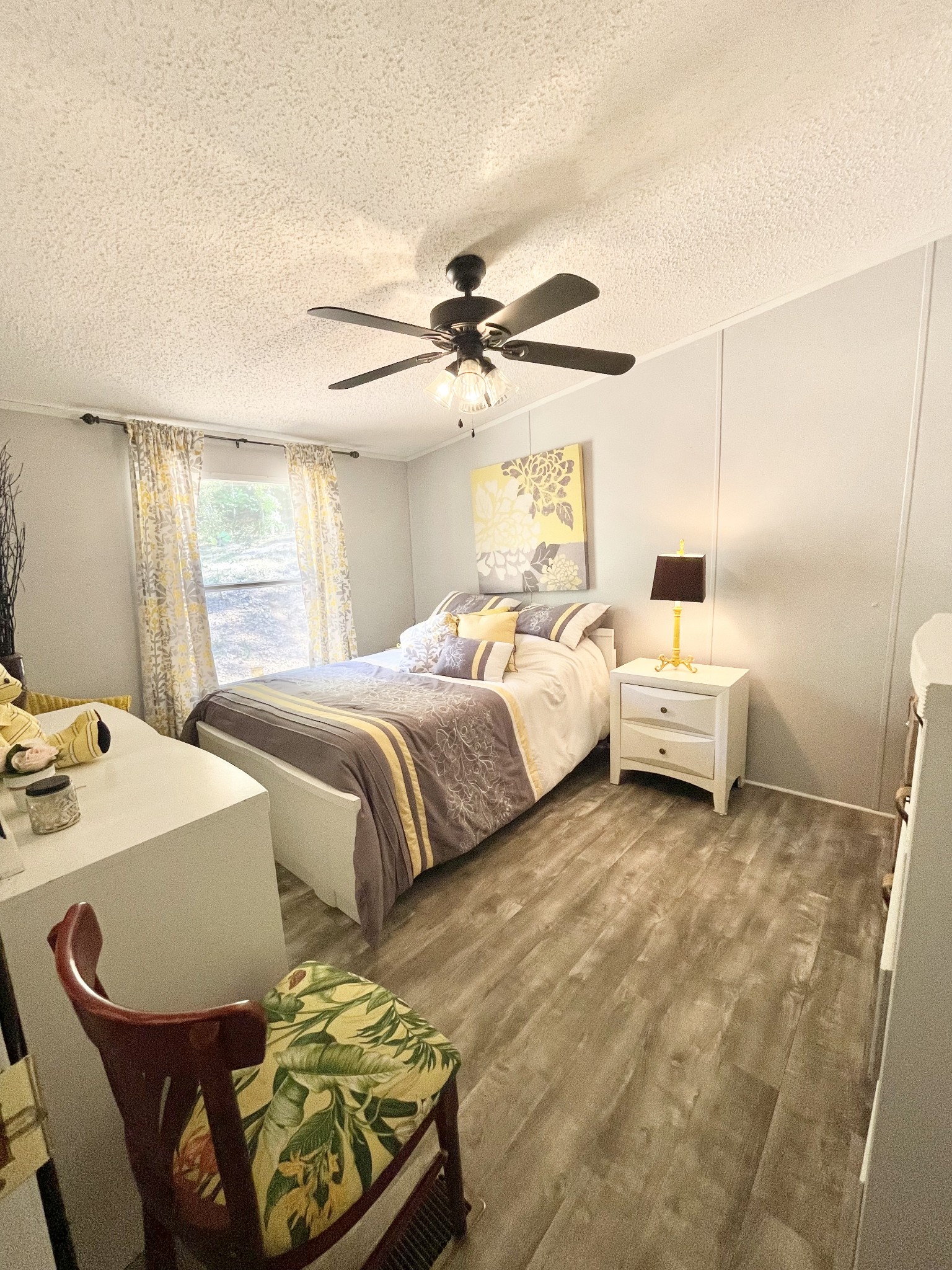 7593 Todd Road Westpoint, TN 38486 - Photo 13 of 41 a bedroom with a bed and a chandelier