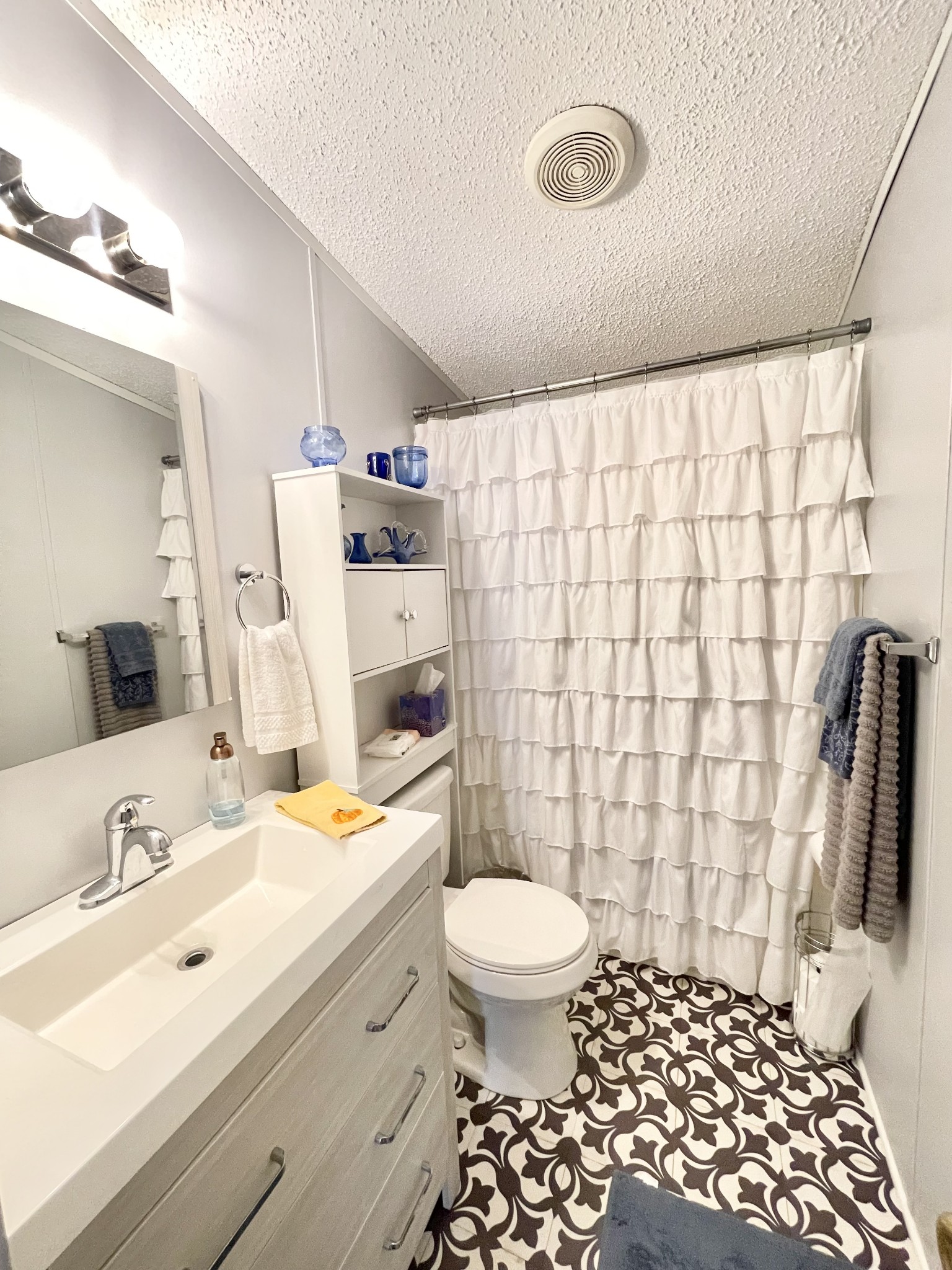 7593 Todd Road Westpoint, TN 38486 - Photo 15 of 41 a bathroom with a sink toilet and shower