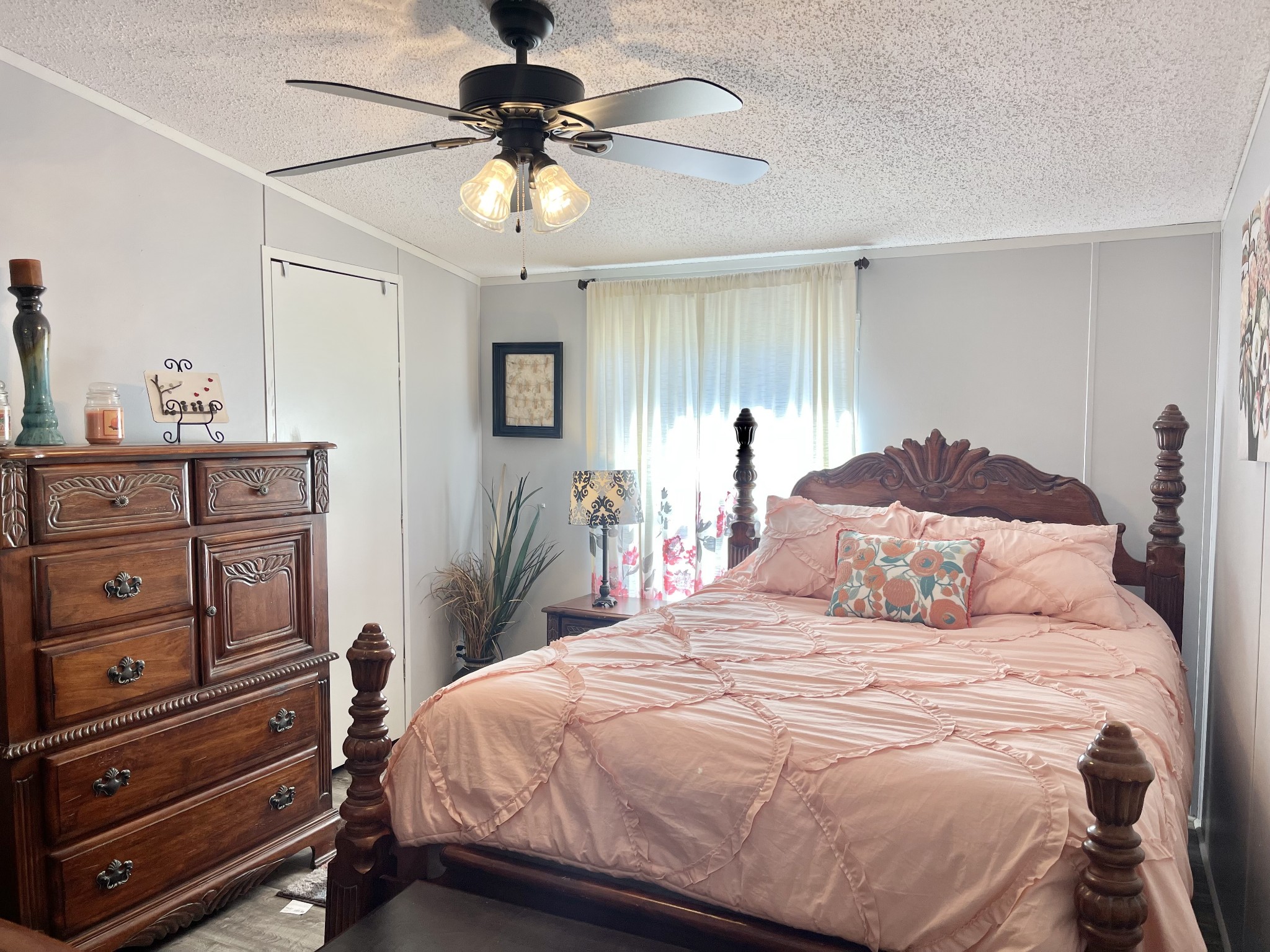 7593 Todd Road Westpoint, TN 38486 - Photo 16 of 41 a bedroom with a bed and a chandelier