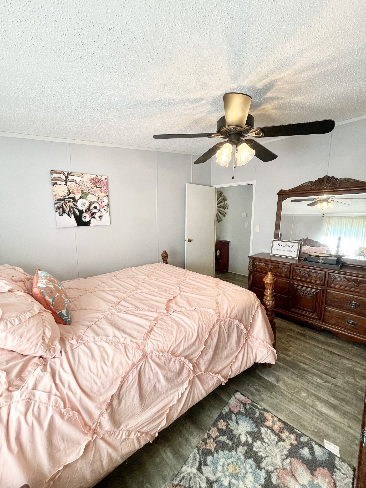 7593 Todd Road Westpoint, TN 38486 - Photo 17 of 41 a bedroom with a bed and dresser with mirror