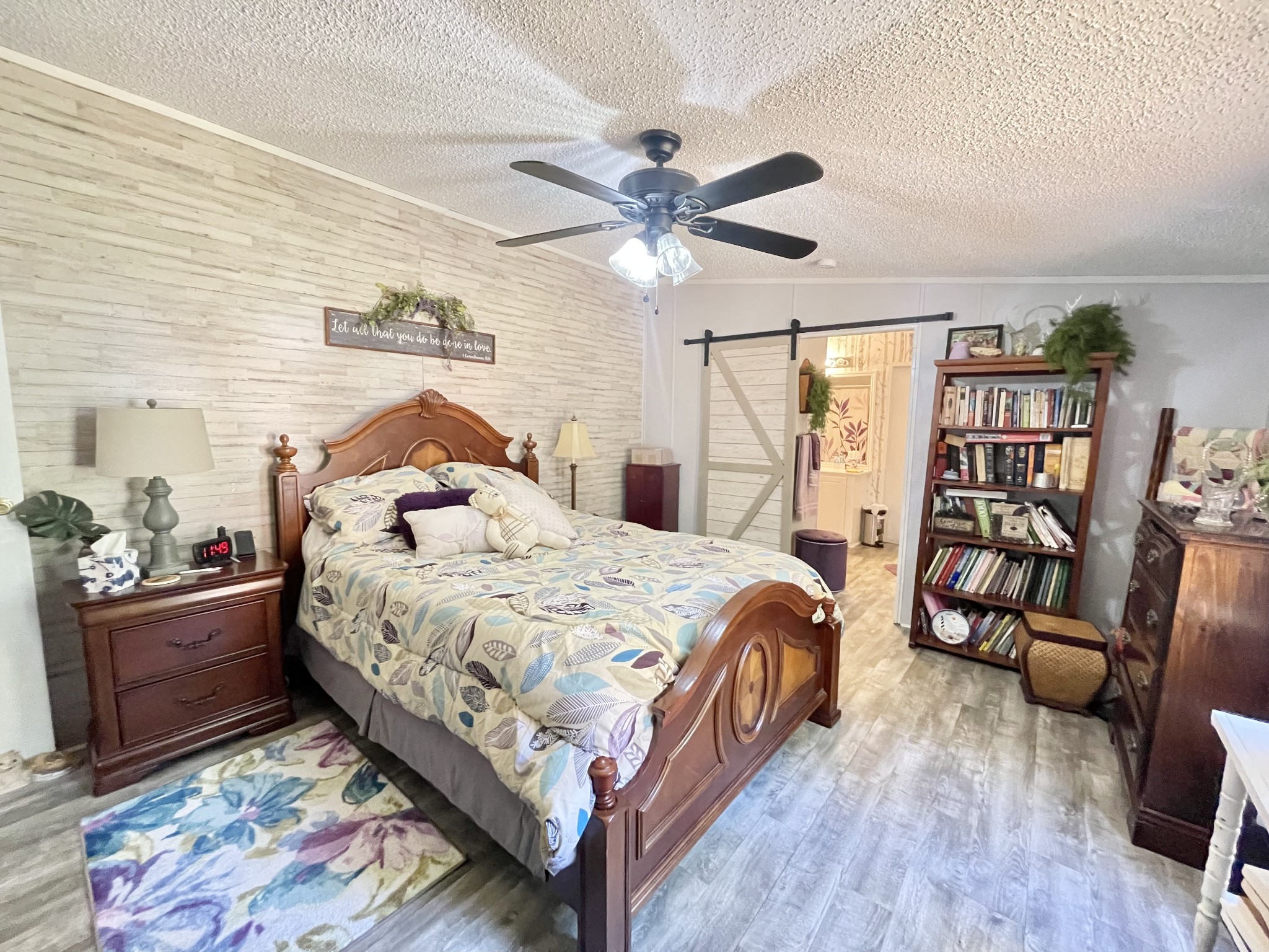 7593 Todd Road Westpoint, TN 38486 - Photo 19 of 41 a bedroom with a bed and wooden floor
