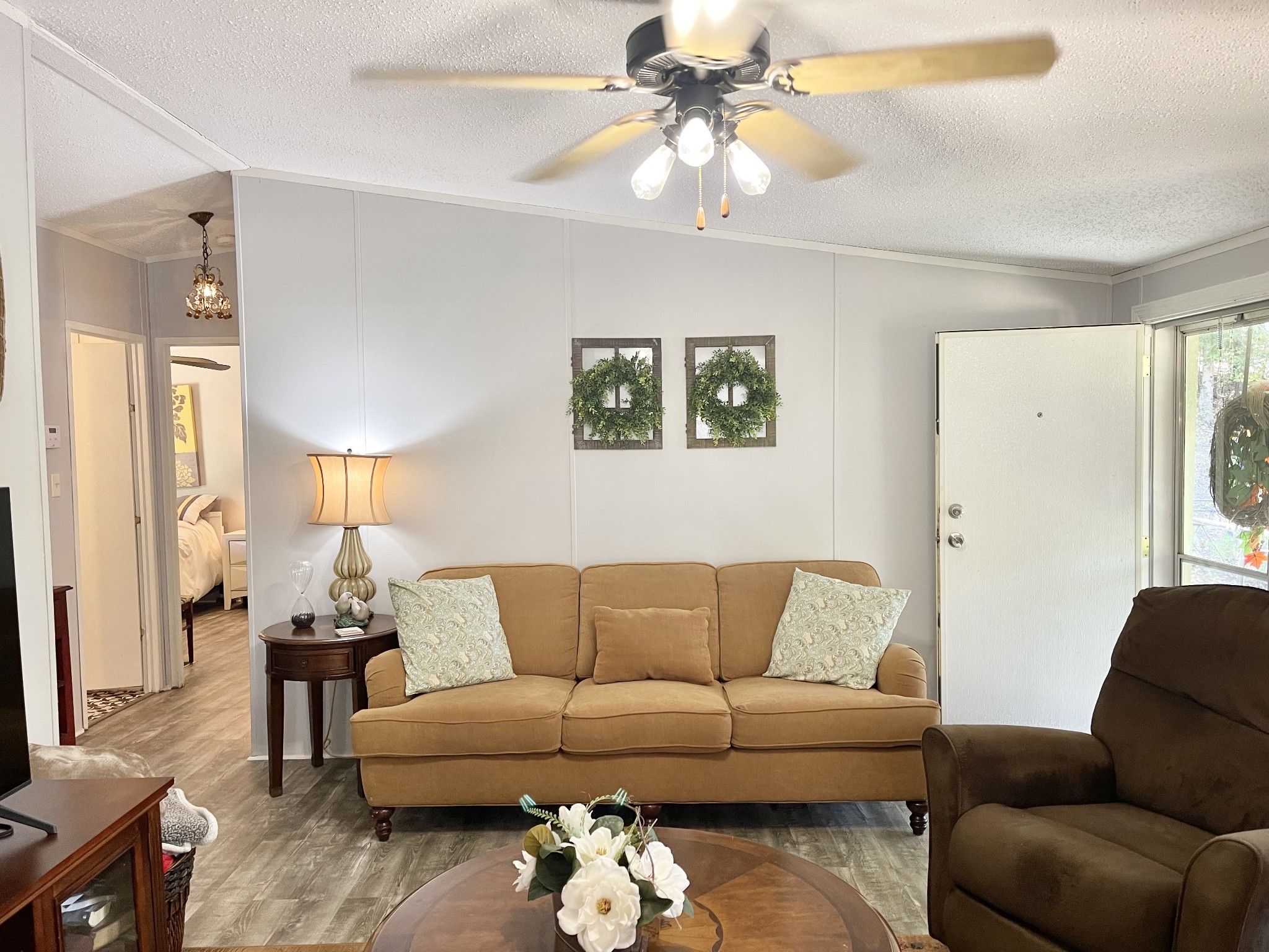 7593 Todd Road Westpoint, TN 38486 - Photo 2 of 41 a living room with furniture and a ceiling fan